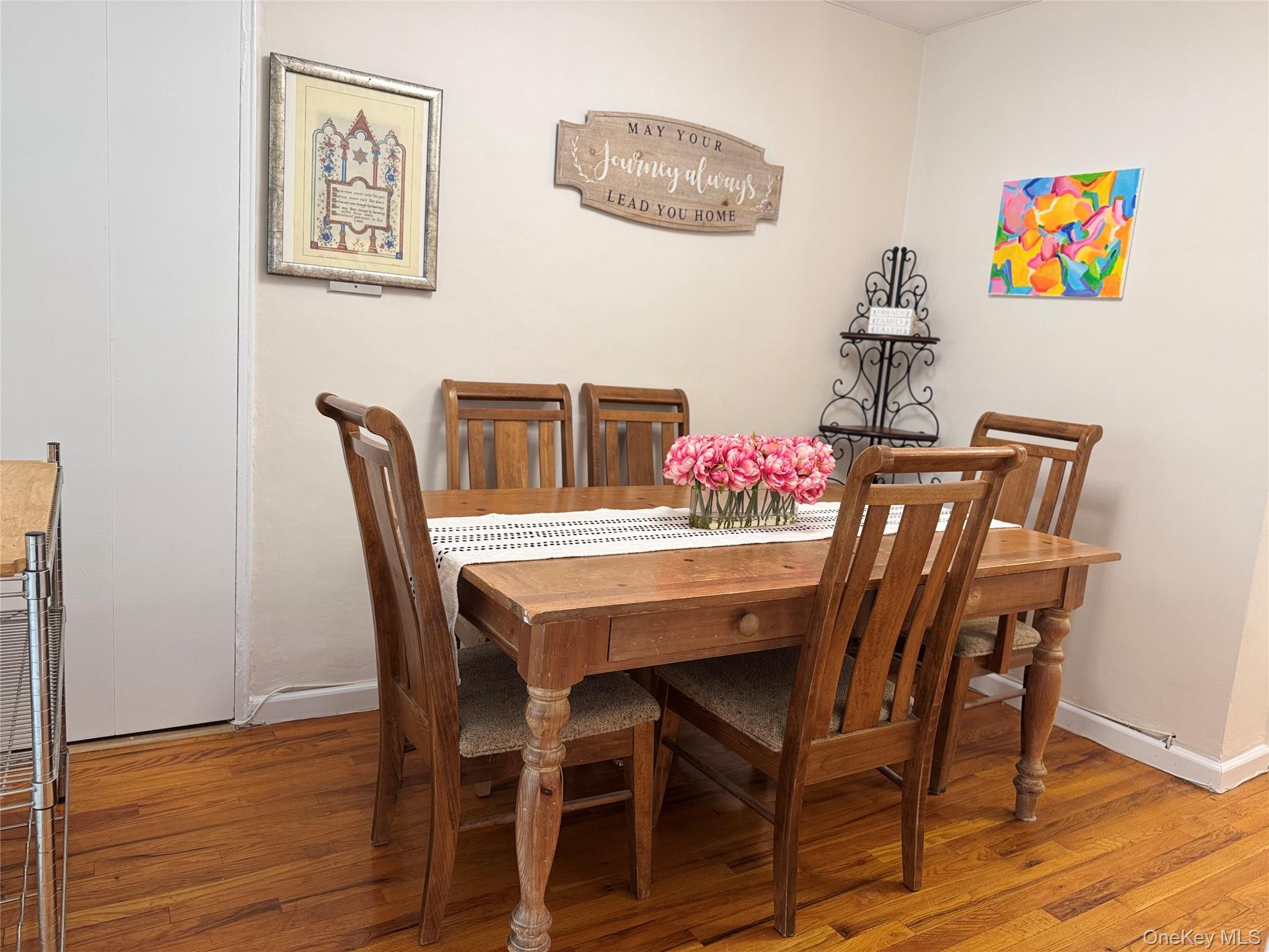 139-15 83rd Avenue, Unit 409 Queens, NY 11435 - Photo 12 of 38 a view of a dining room with furniture and wooden floor