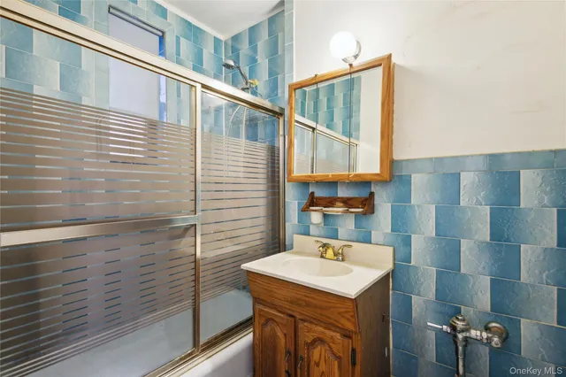 a bathroom with a sink and mirror