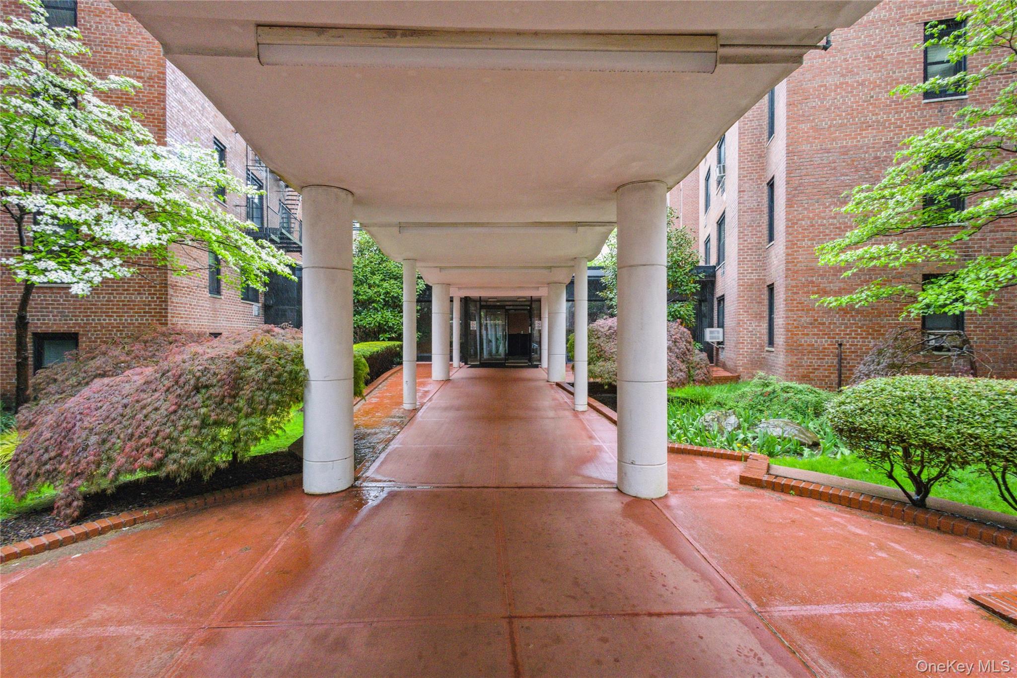 139-15 83rd Avenue, Unit 409 Queens, NY 11435 - Photo 5 of 38 a view of a house with porch and garden