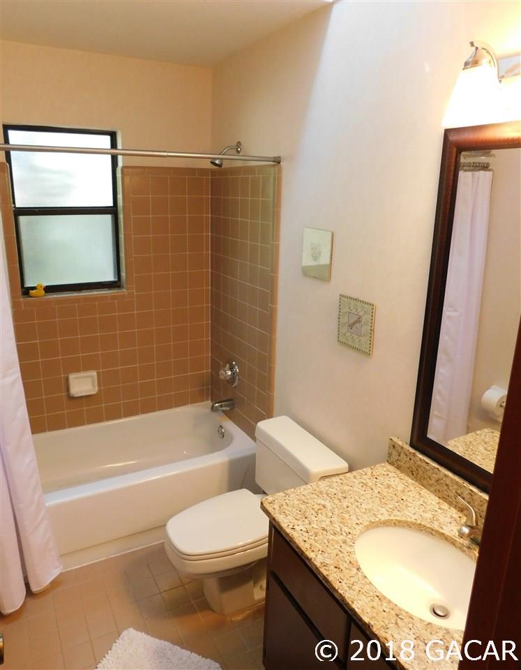 1710 Southwest 78th Street Gainesville, FL 32607 - Photo 14 of 30 Guest Bathroom Looking to South