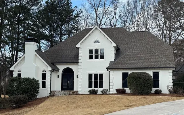 a front view of a house with yard