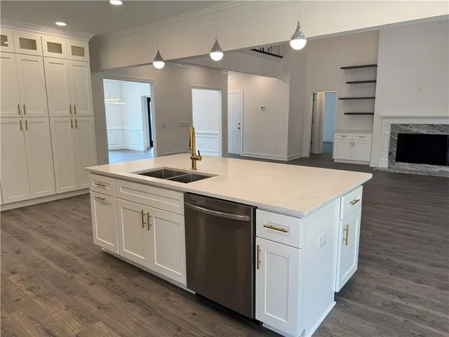 a kitchen with a sink and a refrigerator