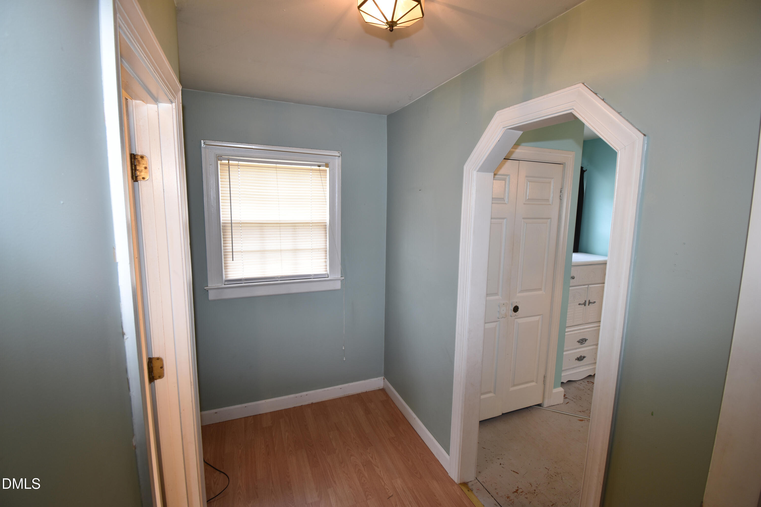 5868 Massey Road Zebulon, NC 27597 - Photo 11 of 24 an entryway view with wooden floor windows and a hallway