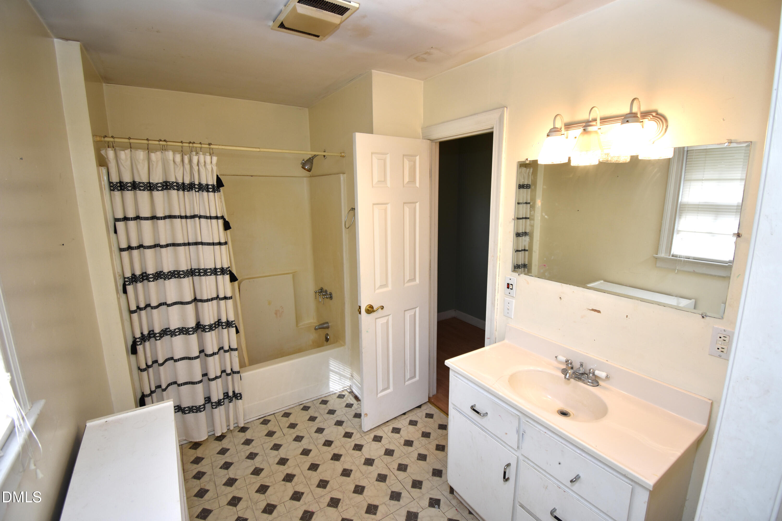 5868 Massey Road Zebulon, NC 27597 - Photo 17 of 24 a bathroom with a sink a toilet and shower