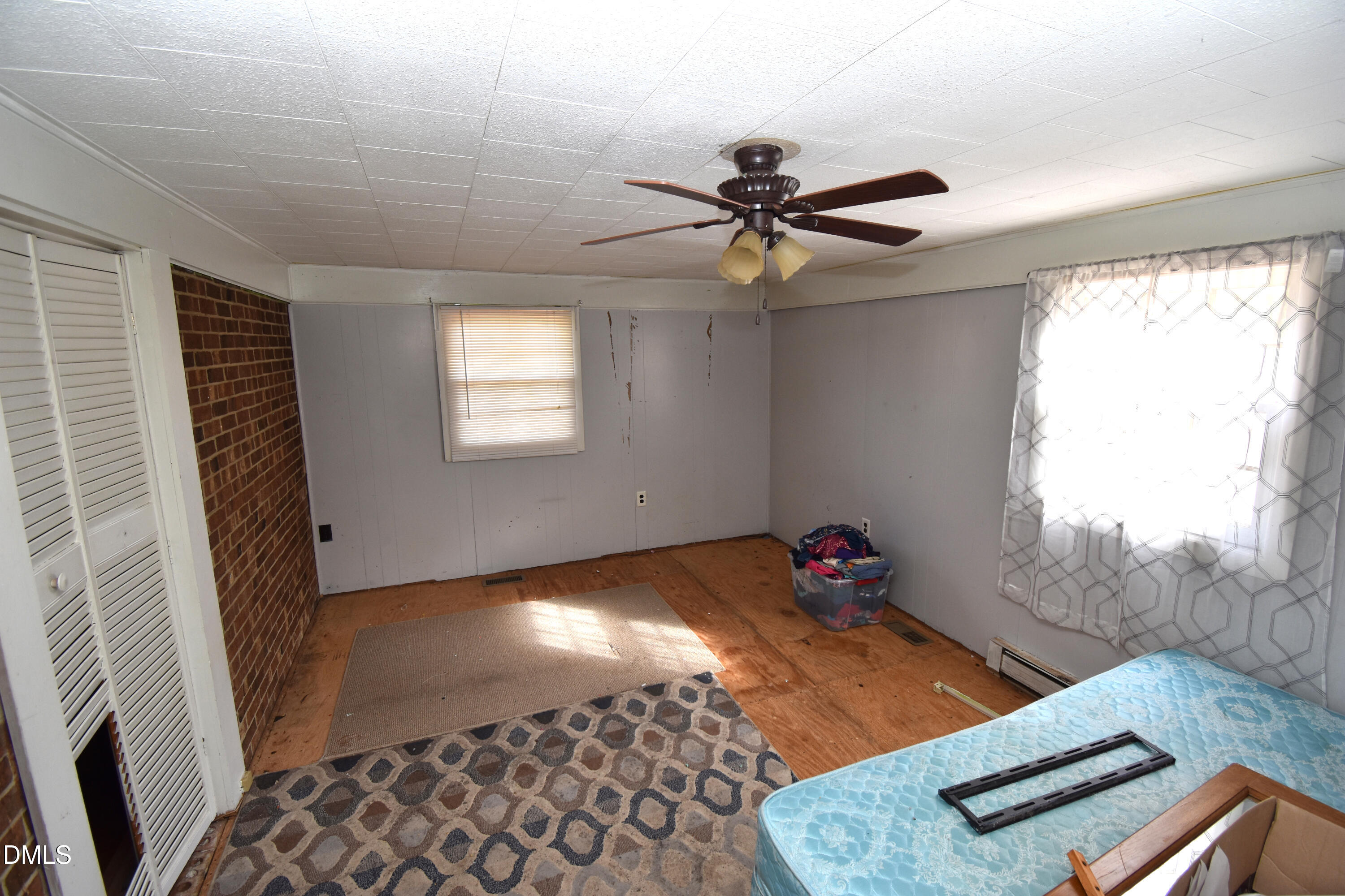 5868 Massey Road Zebulon, NC 27597 - Photo 19 of 24 a bedroom with bed and window
