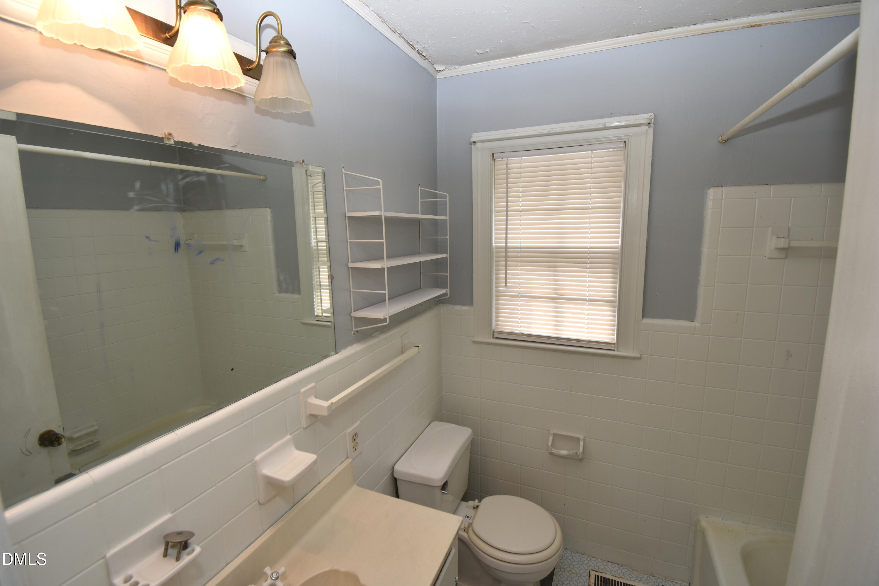 5868 Massey Road Zebulon, NC 27597 - Photo 20 of 24 a bathroom with a toilet a sink and shower