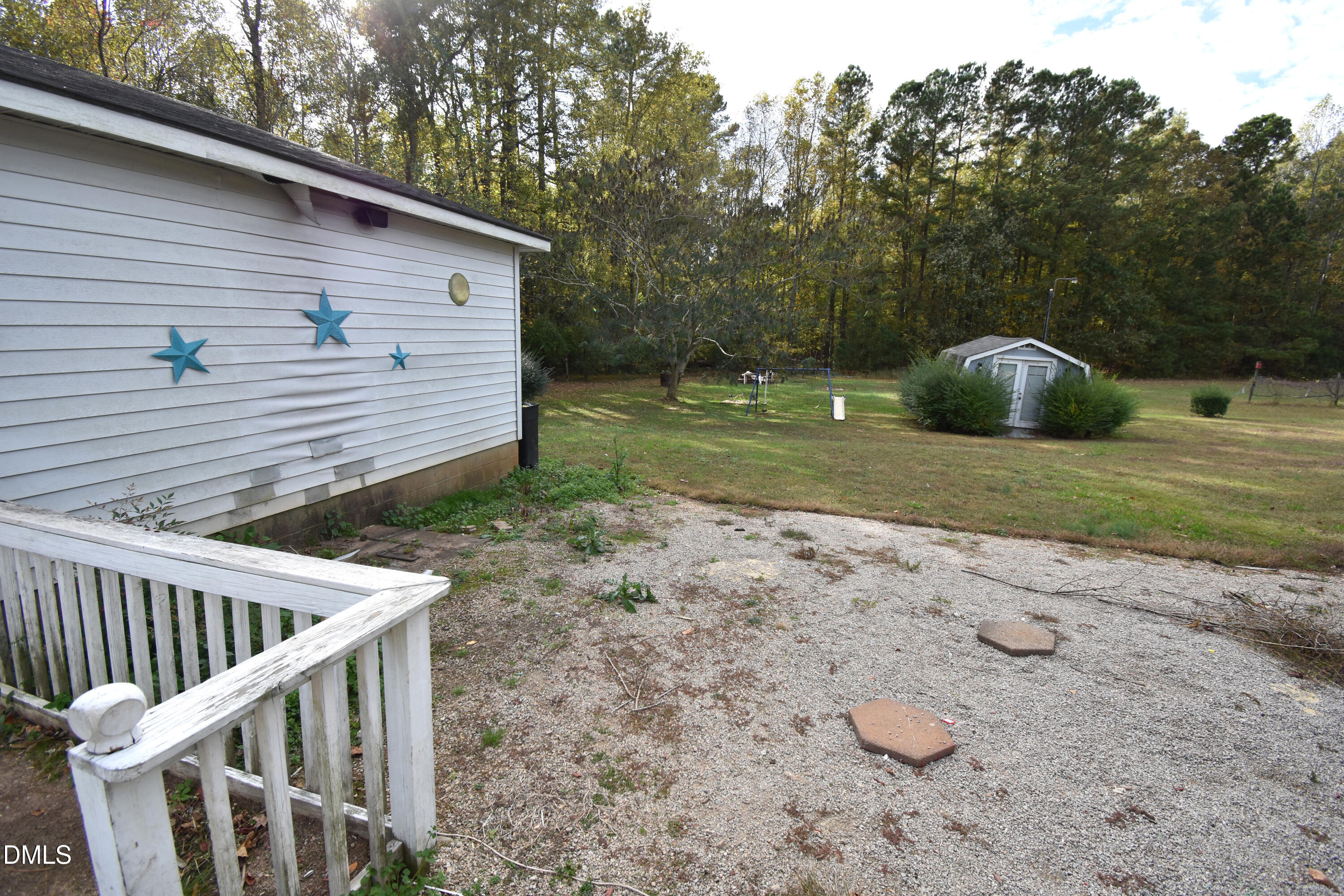 5868 Massey Road Zebulon, NC 27597 - Photo 24 of 24 a view of backyard with deck and trees