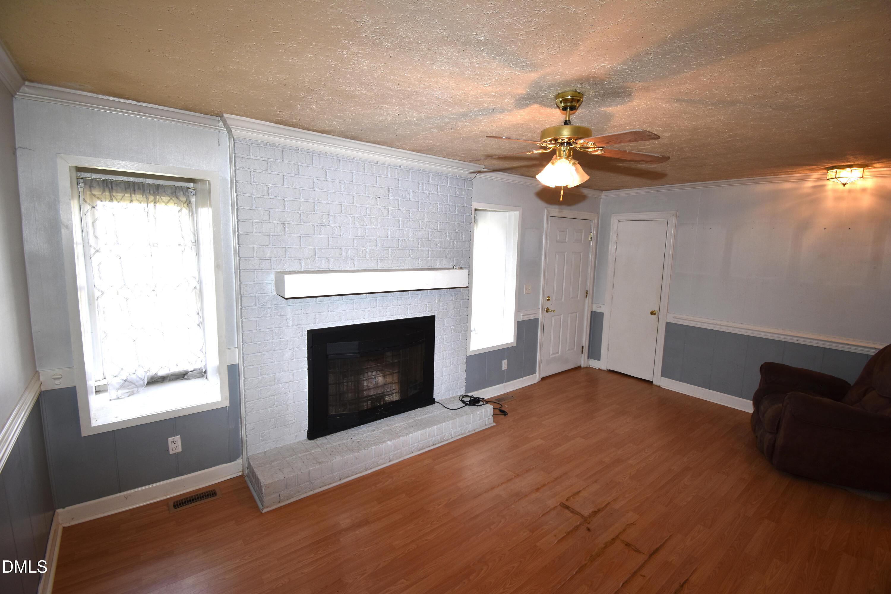 5868 Massey Road Zebulon, NC 27597 - Photo 9 of 24 a living room with furniture and a fireplace