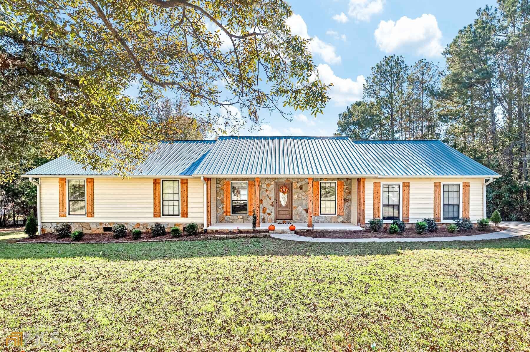 2364 Keys Ferry Road Jackson, GA 30233 - Photo 1 of 1 a front view of a house with a yard and trees