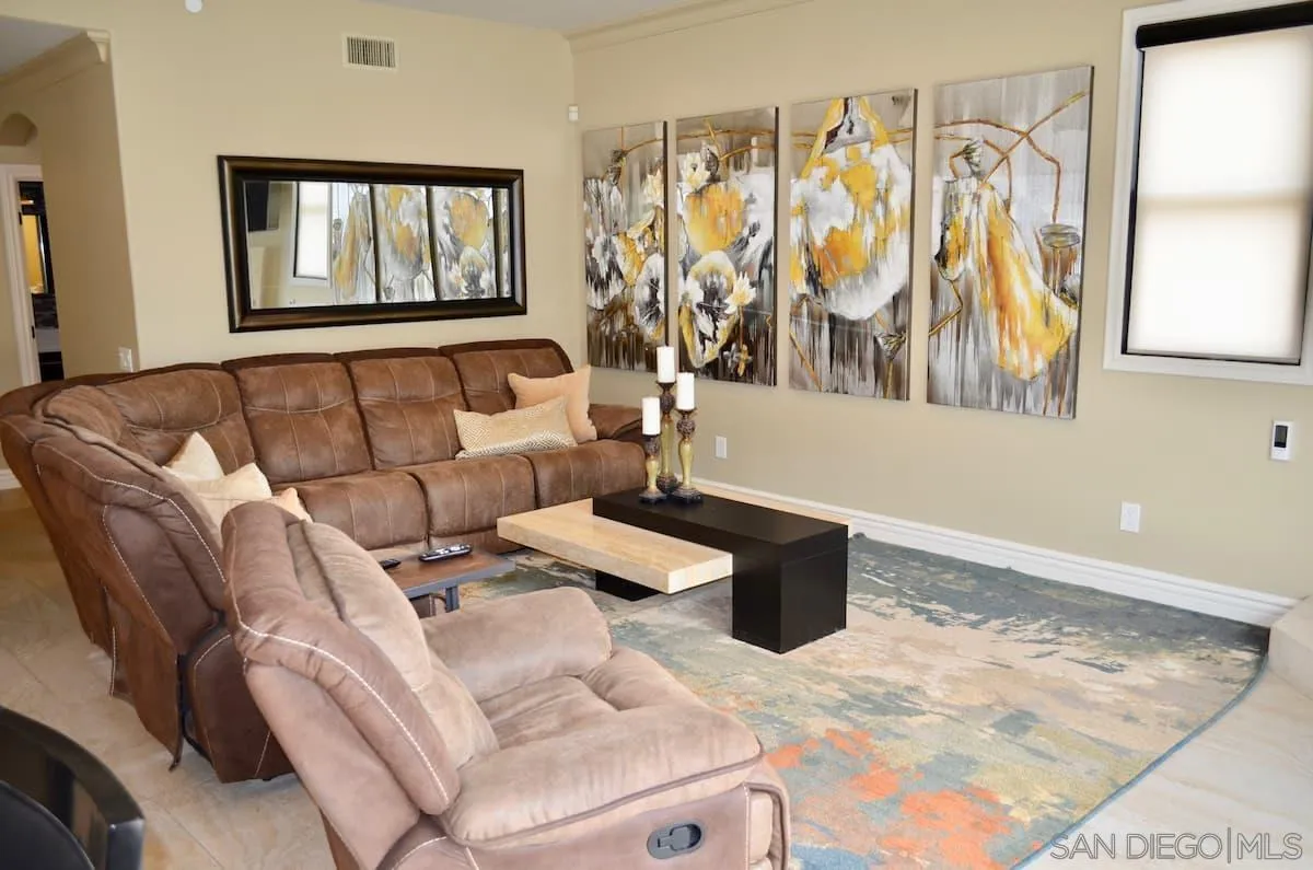 1235 Neptune Avenue Encinitas, CA 92024 - Photo 11 of 32 a living room with furniture and painting on the wall