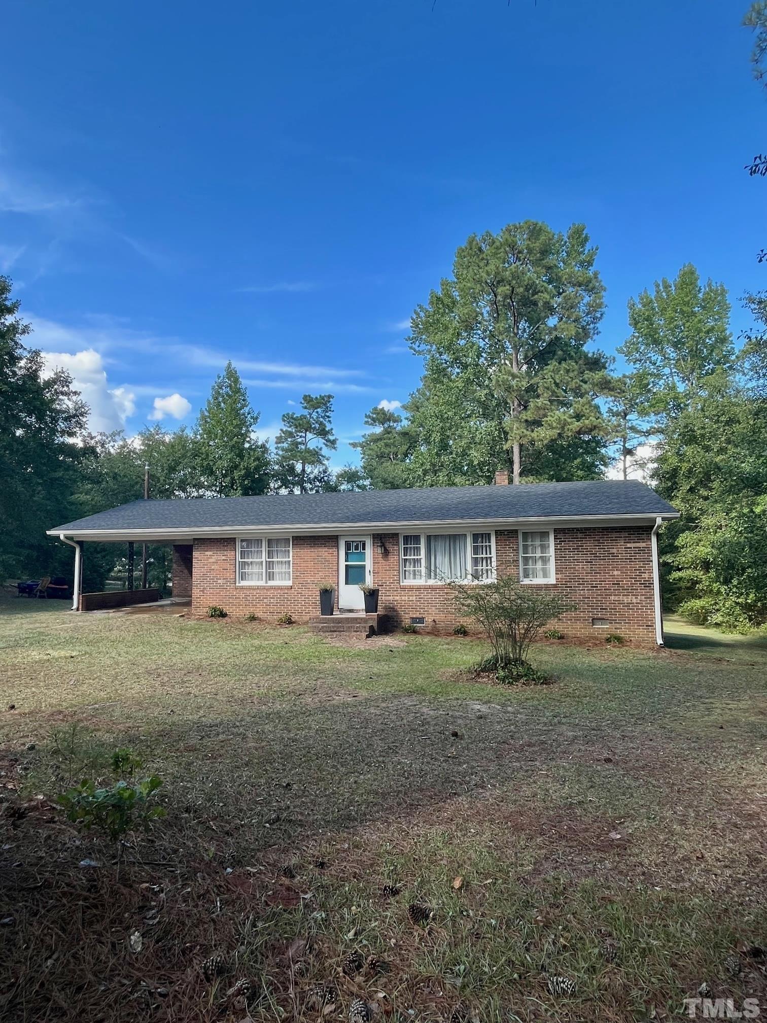 2342 Mitchell Road Angier, NC 27501 - Photo 3 of 10 front view of a house with a yard