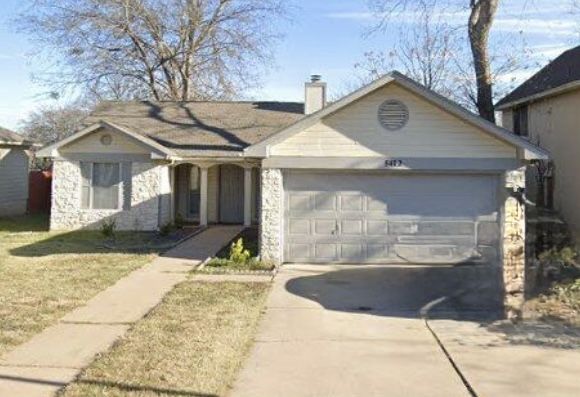 5412 Mesquite Grove Road Austin, TX 78744 - Photo 1 of 15 a front view of a house with a yard