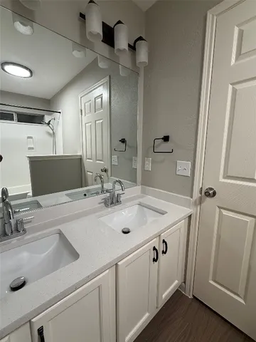 a view of a sink and mirror