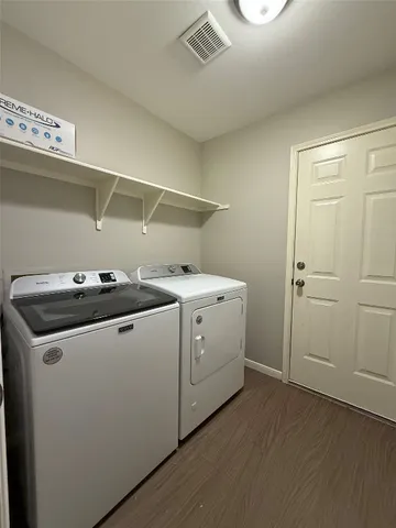 a utility room with dryer and washer