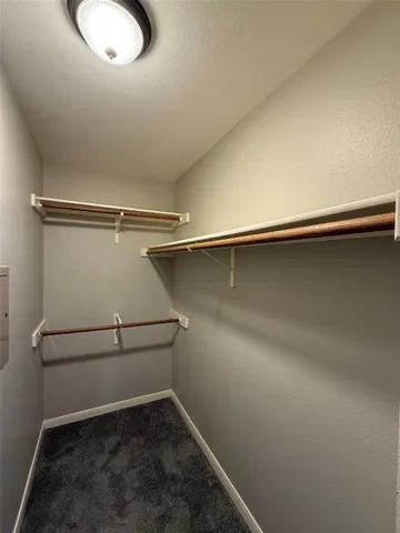 an empty room with a wooden floor and a window