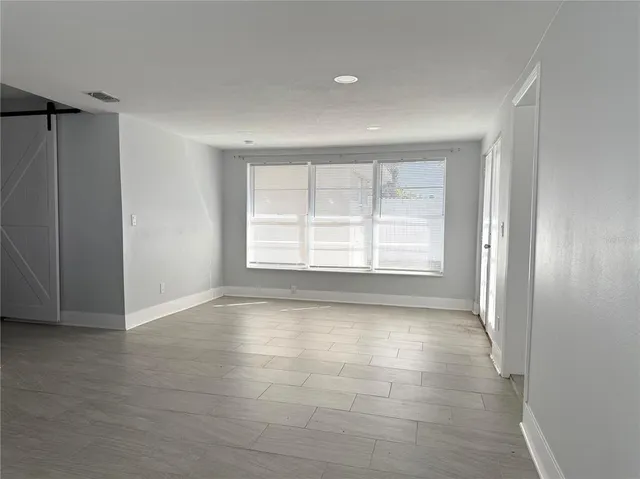 a view of an empty room with a window