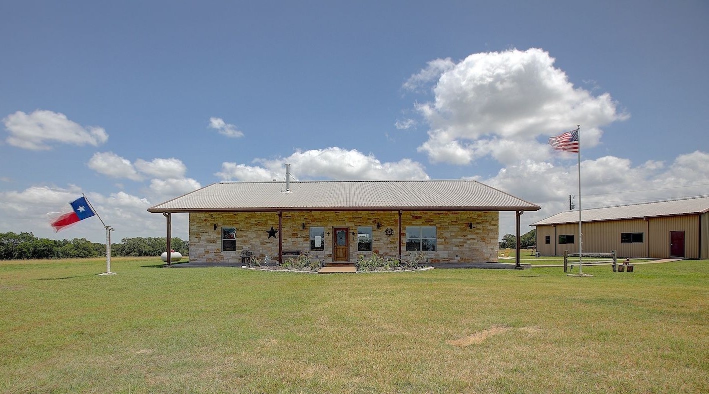 9414 Laird Road Round Top, TX 78954 - Photo 2 of 50 Front facade of the home with 3 acres in the front and 7 acres behind the home