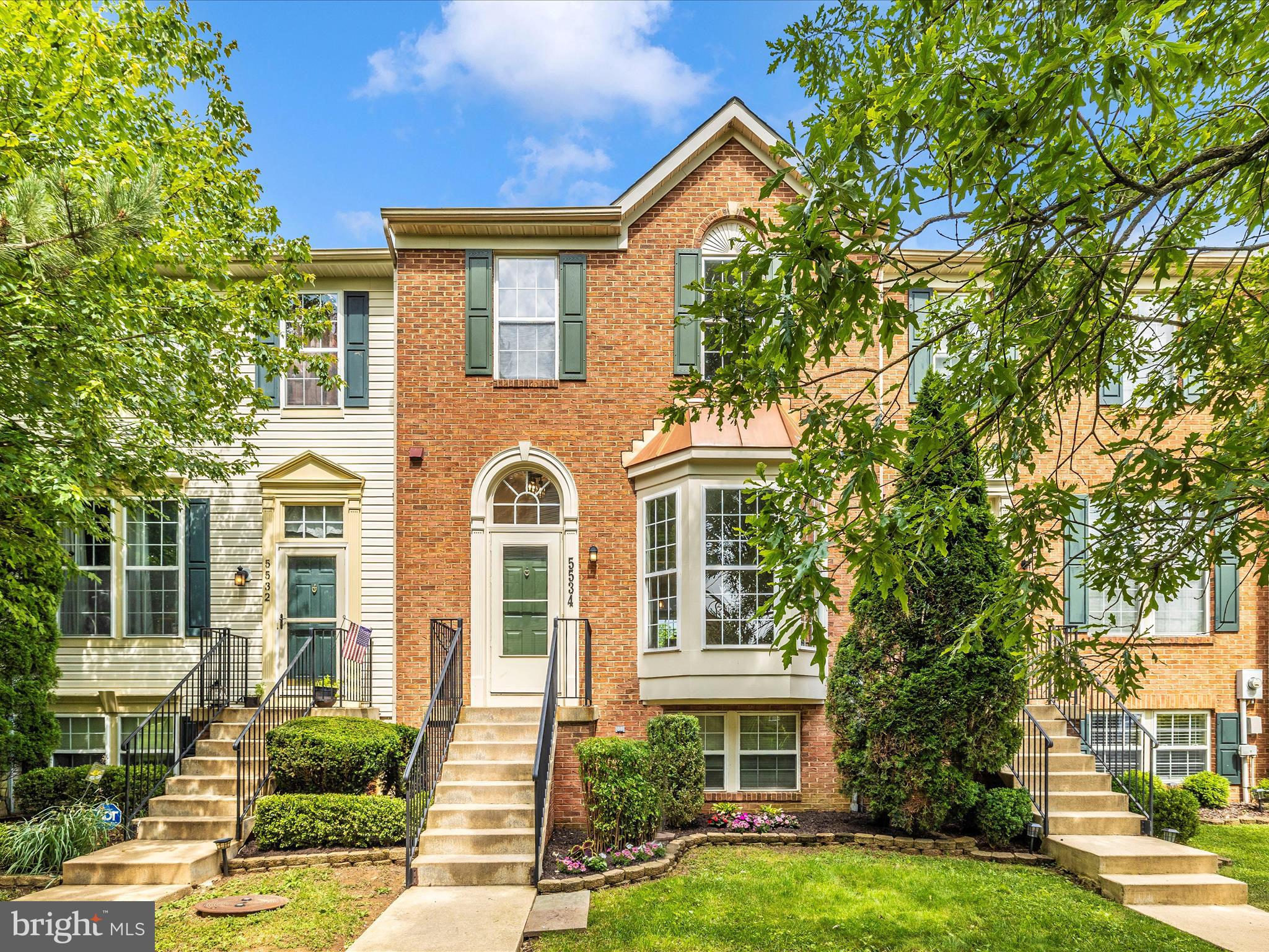 5534 Upshur Square Frederick, MD 21703 - Photo 1 of 46 a front view of a house with a garden