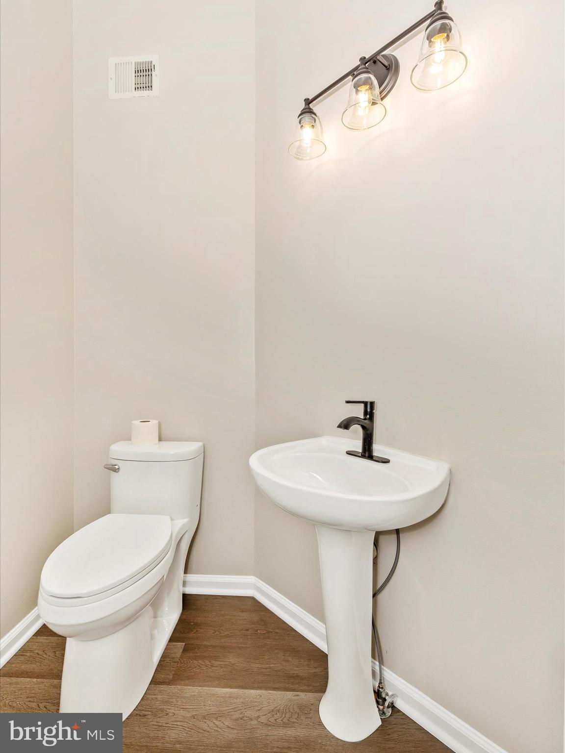 5534 Upshur Square Frederick, MD 21703 - Photo 20 of 46 a bathroom with a sink toilet and a mirror