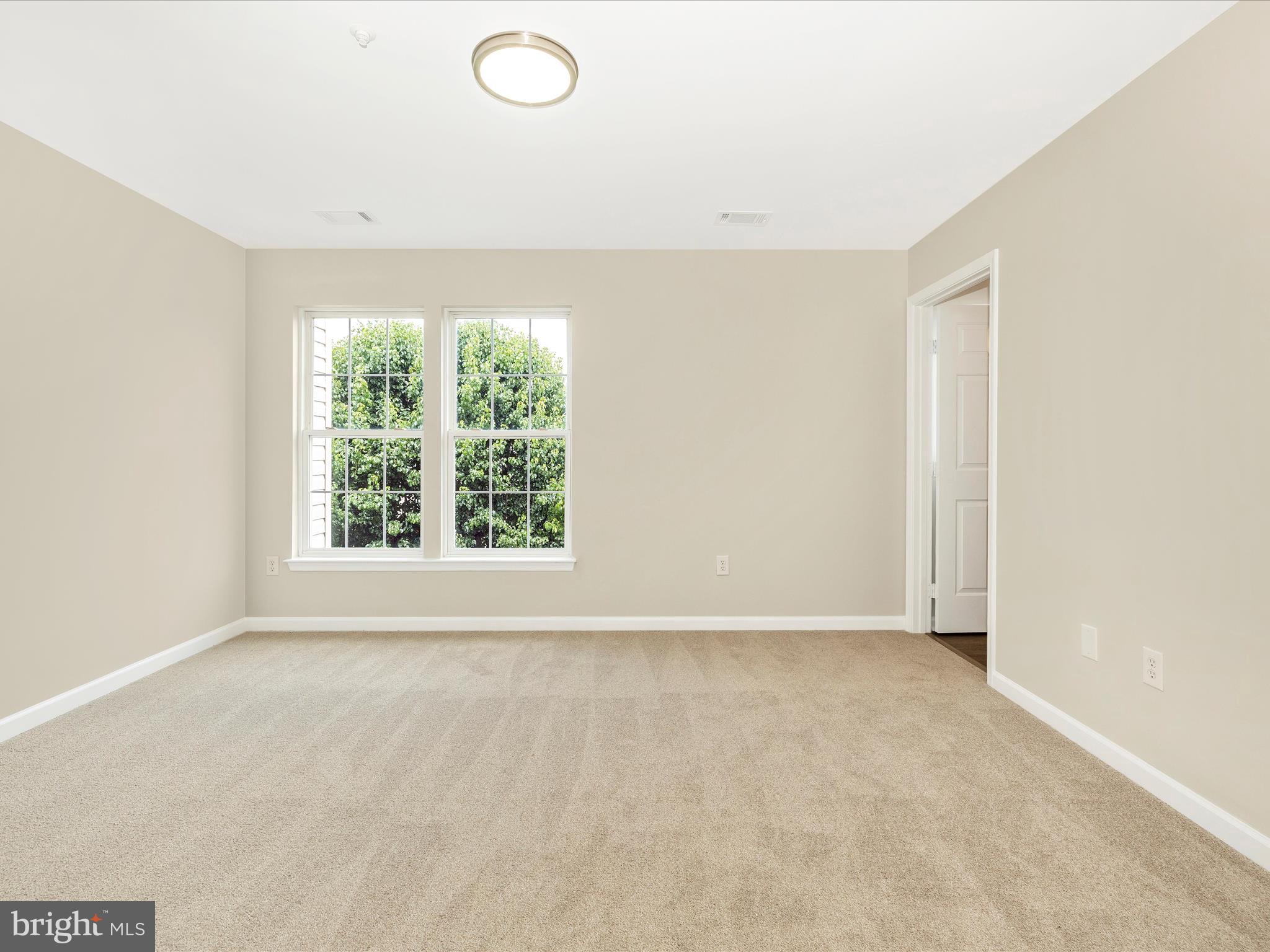 5534 Upshur Square Frederick, MD 21703 - Photo 23 of 46 an empty room with windows