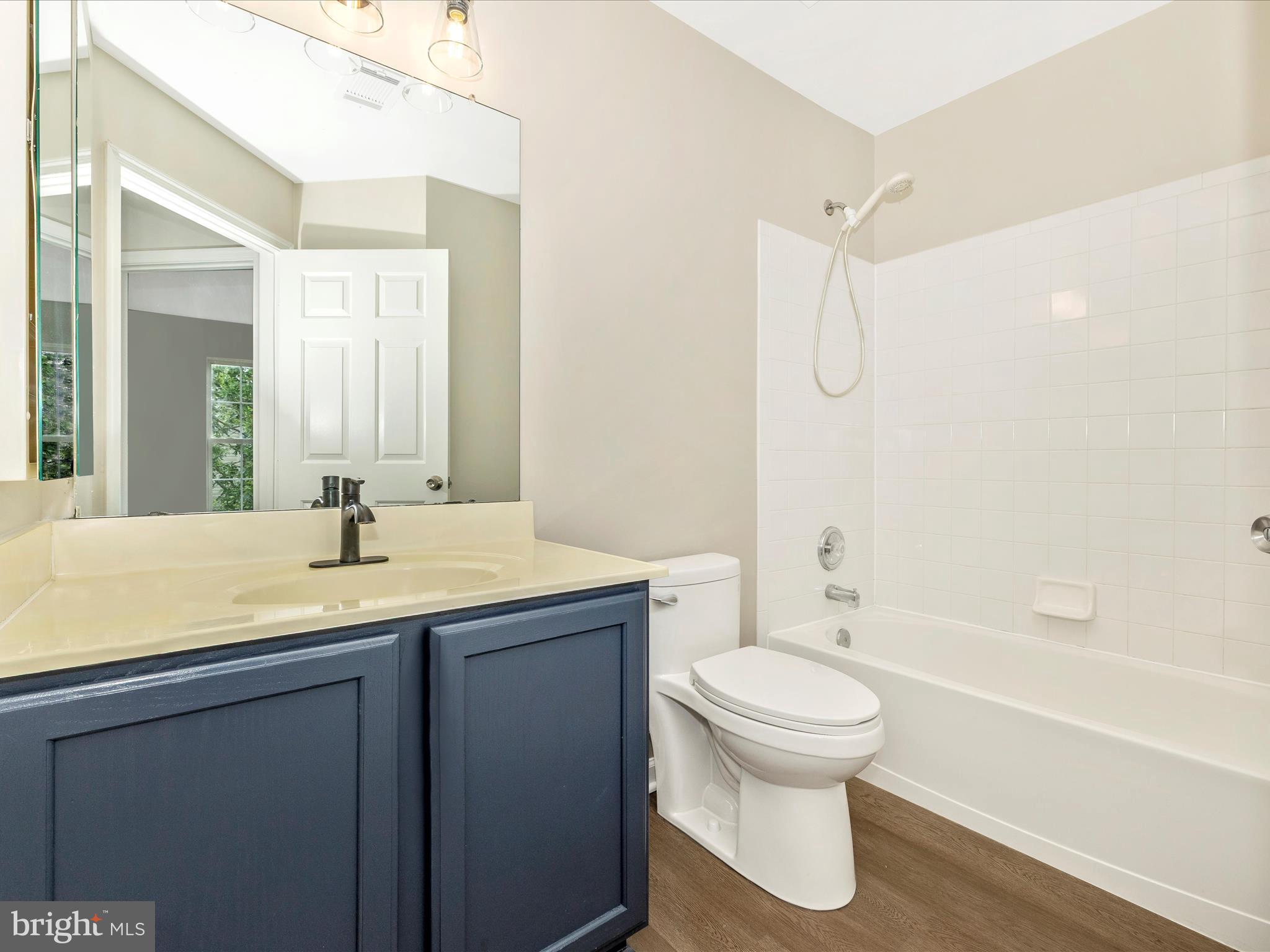 5534 Upshur Square Frederick, MD 21703 - Photo 30 of 46 a bathroom with a granite countertop sink toilet and shower