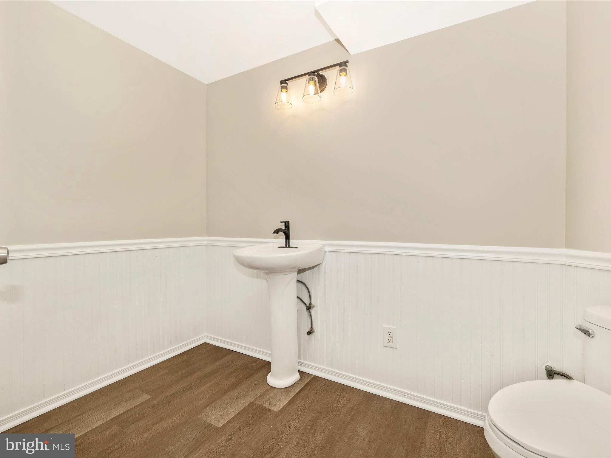 5534 Upshur Square Frederick, MD 21703 - Photo 35 of 46 a bathroom with a sink a toilet and a mirror