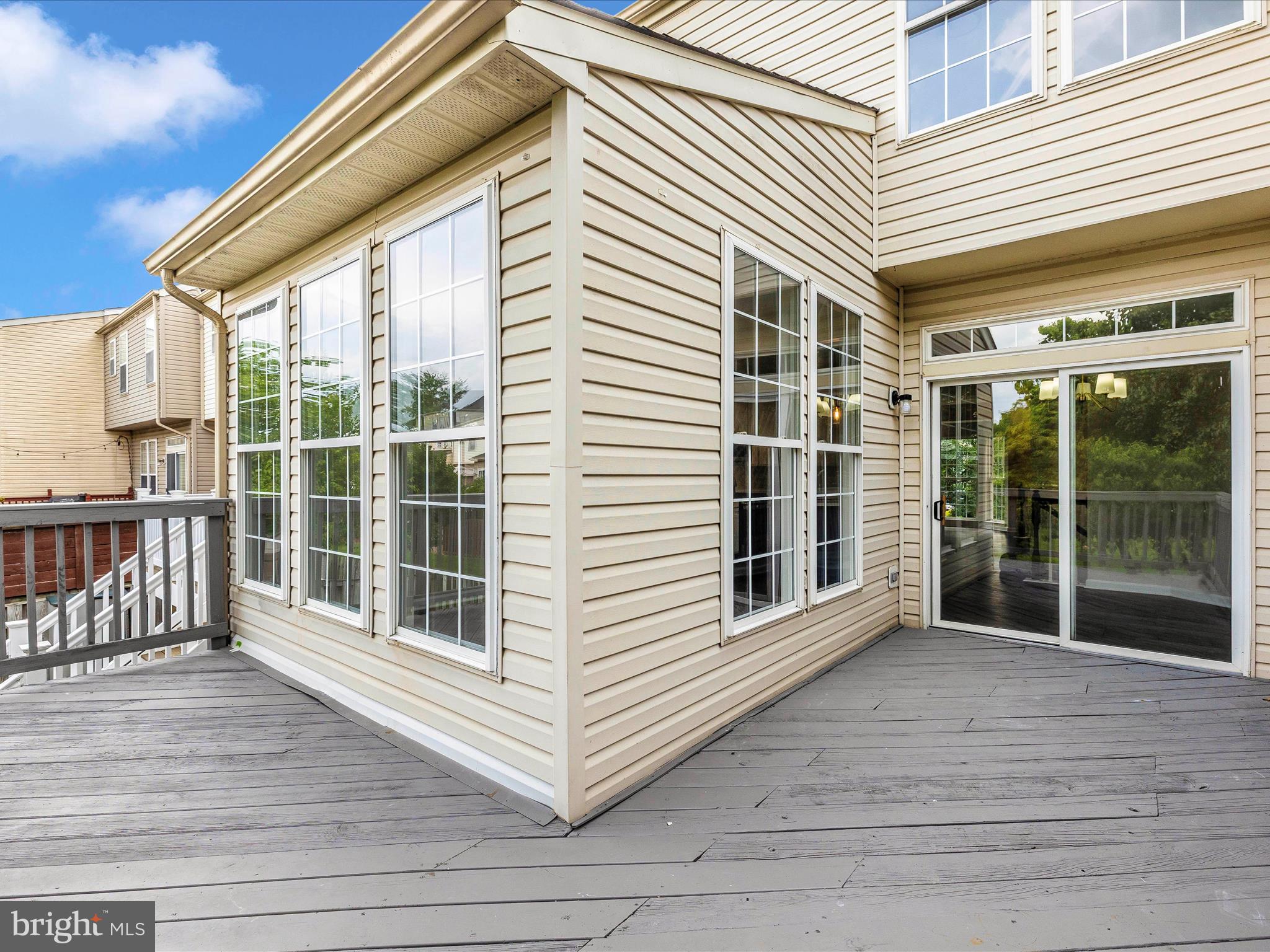 5534 Upshur Square Frederick, MD 21703 - Photo 41 of 46 a view of a porch with wooden floor and deck