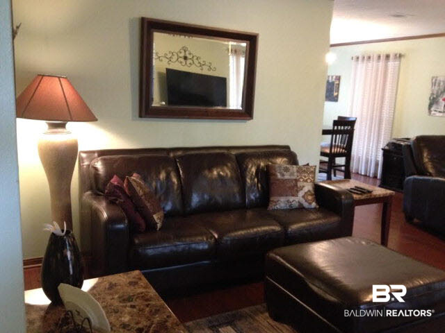 111 Woodside Drive Daphne, AL 36526 - Photo 2 of 31 Spacious greatroom with 5" hardwood floors . Opens to formal dining room with french doors accessing the outdoor decks.
