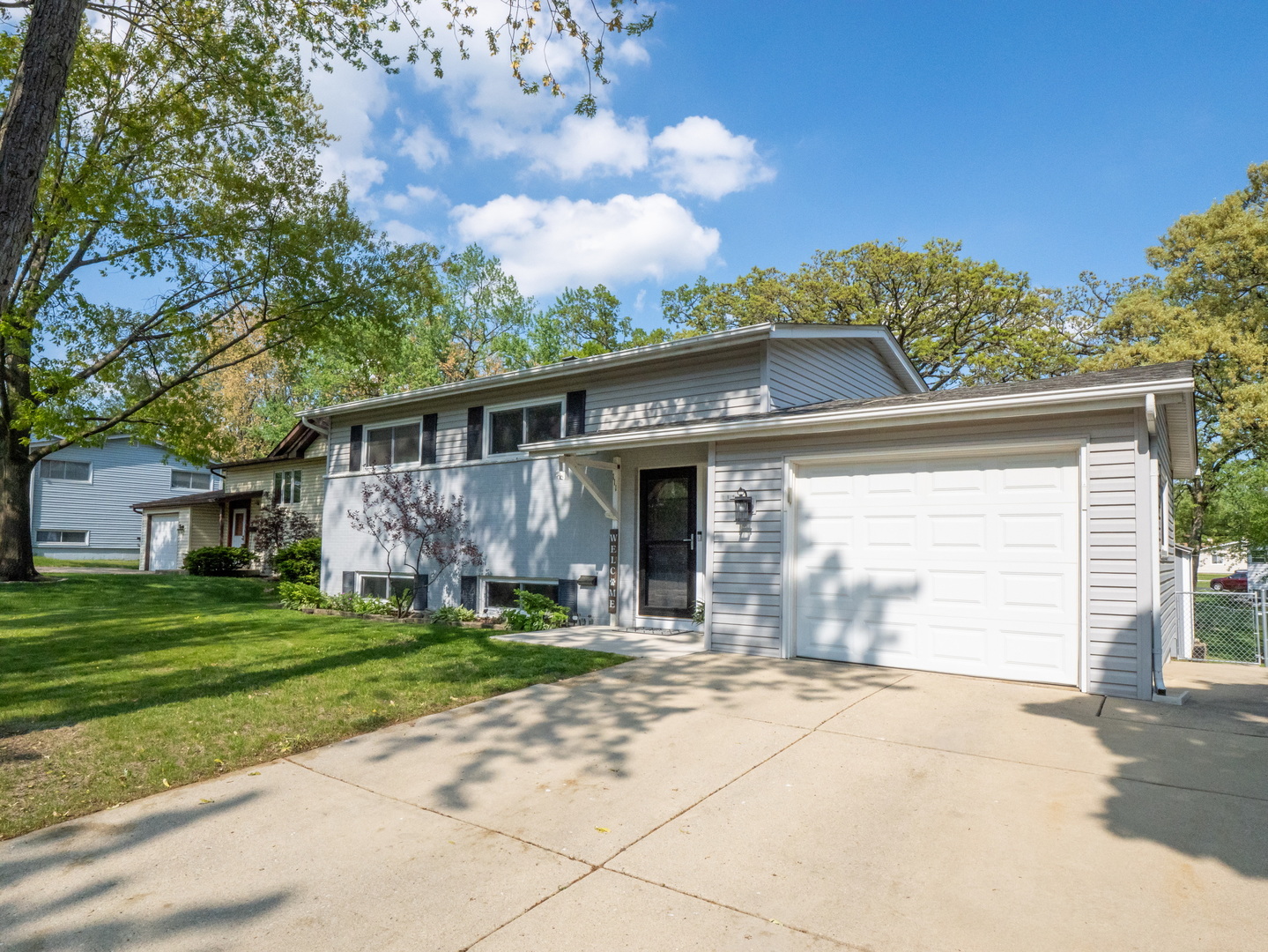 111 Timber Trail Streamwood, IL 60107 - Photo 1 of 35 a front view of a house with a yard