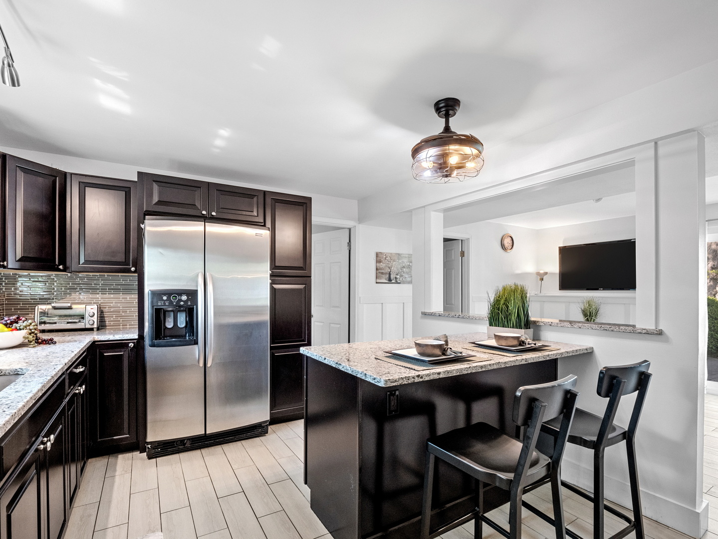 111 Timber Trail Streamwood, IL 60107 - Photo 15 of 35 a kitchen with stainless steel appliances granite countertop a dining table and chairs