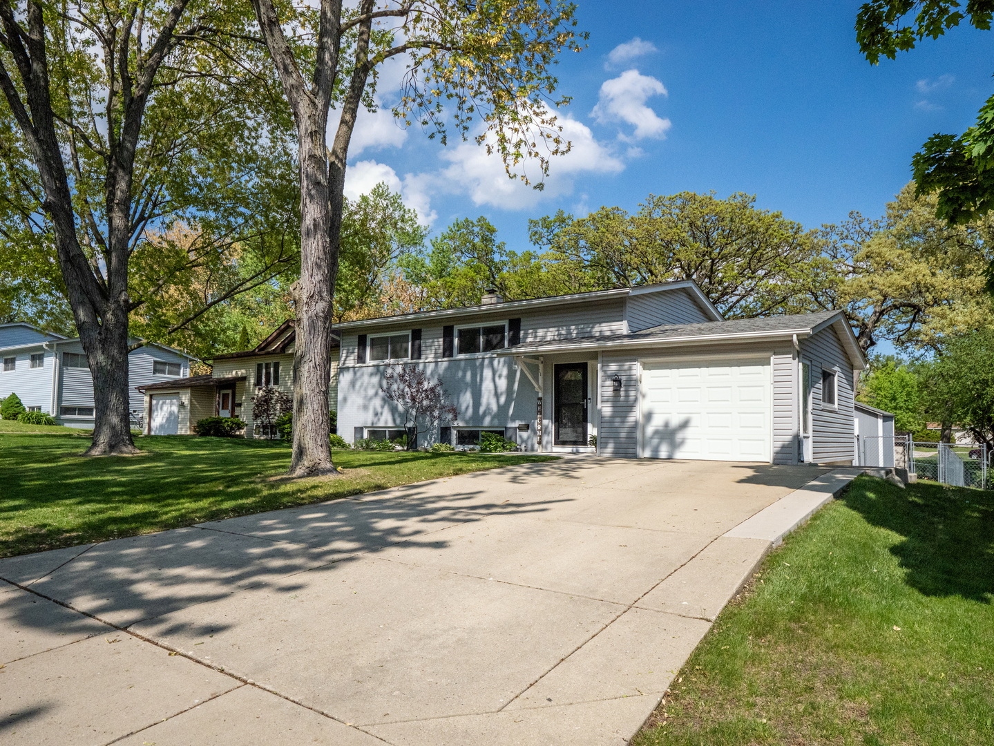 111 Timber Trail Streamwood, IL 60107 - Photo 2 of 35 a view of a house with a yard and large tree