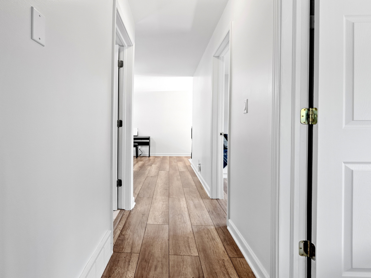 111 Timber Trail Streamwood, IL 60107 - Photo 22 of 35 a view of a hallway with wooden floor and staircase
