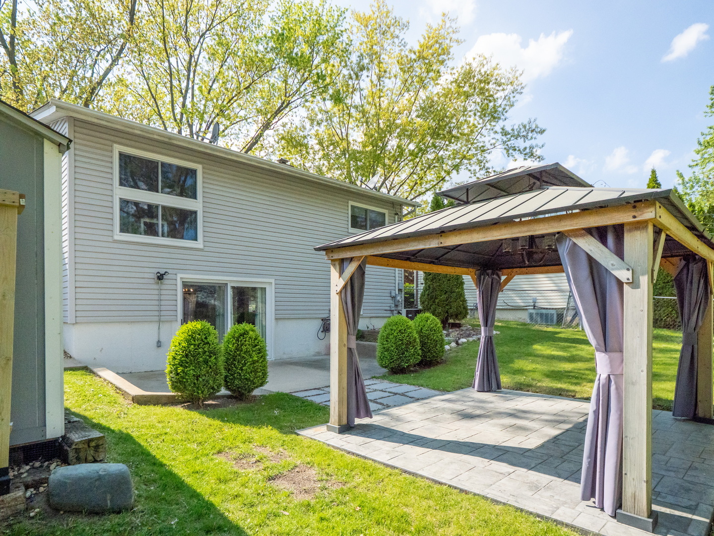 111 Timber Trail Streamwood, IL 60107 - Photo 29 of 35 a view of backyard with plants and outdoor seating