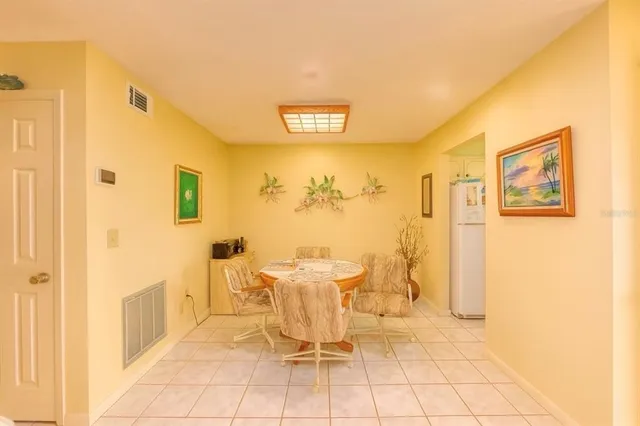 a large kitchen with a sink and cabinets