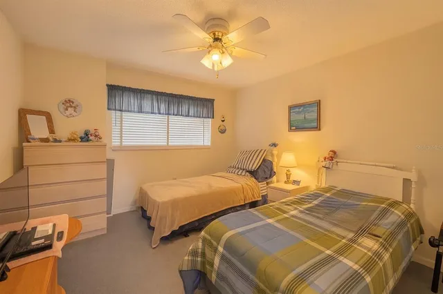 a bathroom with a sink mirror vanity and toilet