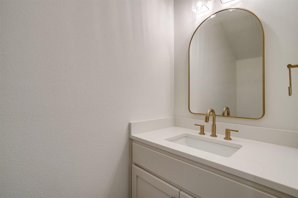 100 Cardinal Wds Granbury, TX 76049 - Photo 15 of 32 a bathroom with a sink and a mirror