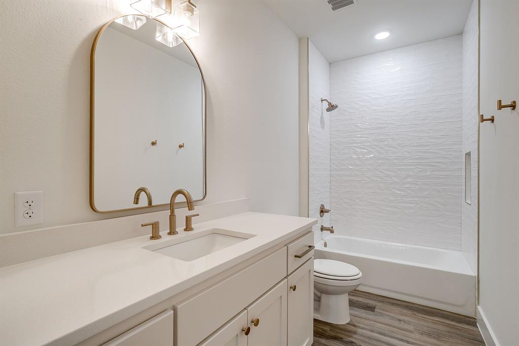 100 Cardinal Wds Granbury, TX 76049 - Photo 26 of 32 a bathroom with a toilet a sink and bathtub