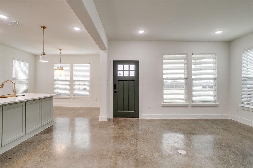 100 Cardinal Wds Granbury, TX 76049 - Photo 3 of 32 a view of an empty room with window and cabinet area