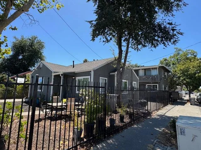 a front view of a house with parking area