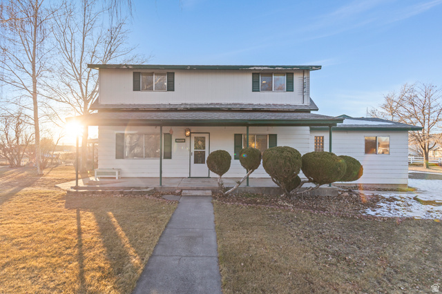 199 North 300 West Monroe, UT 84754 - Photo 1 of 1 Traditional-style home featuring a porch and a front lawn