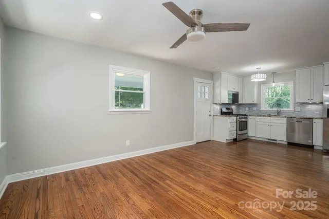 a view of kitchen with wooden floor