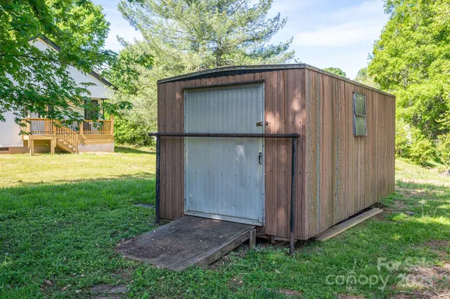 a backyard of a house with wooden fence