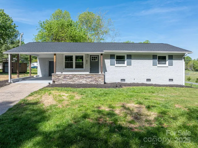 front view of a house with a yard