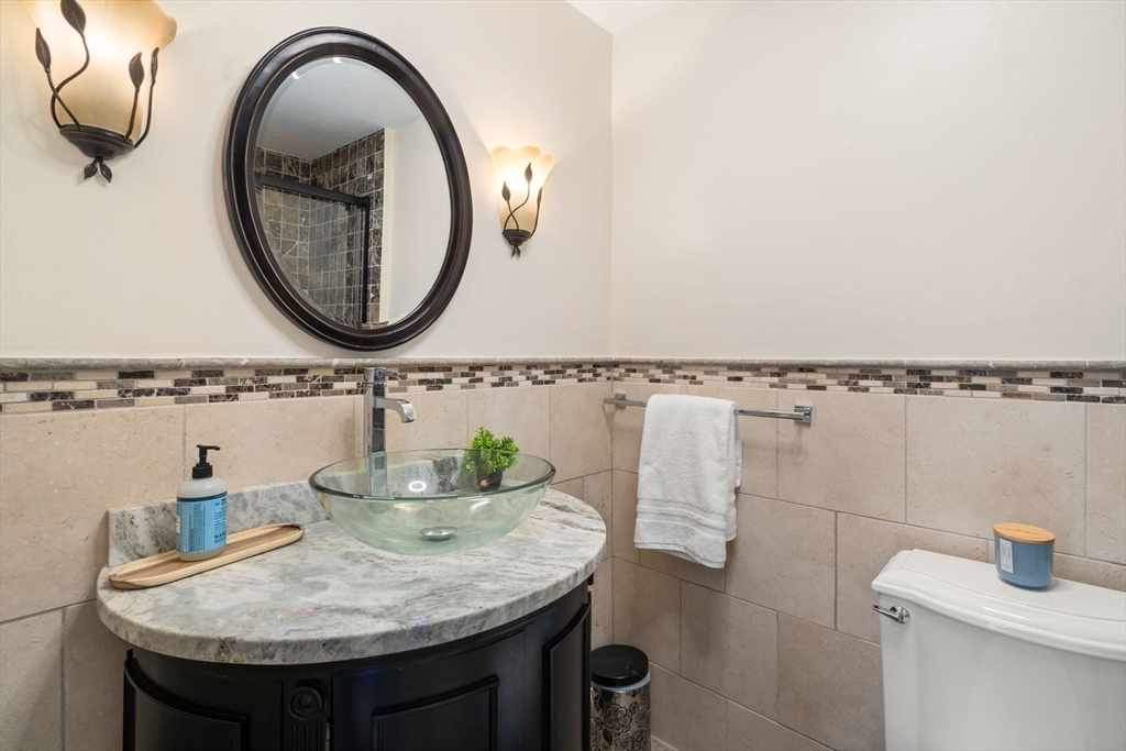 9 Mallard Drive Sharon, MA 02067 - Photo 11 of 32 a bathroom with a sink and a mirror