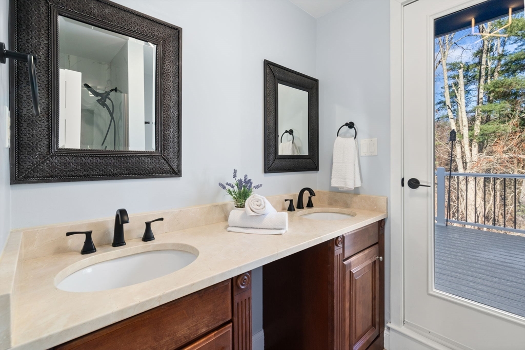 9 Mallard Drive Sharon, MA 02067 - Photo 15 of 32 a bathroom with a double vanity sink mirror and
