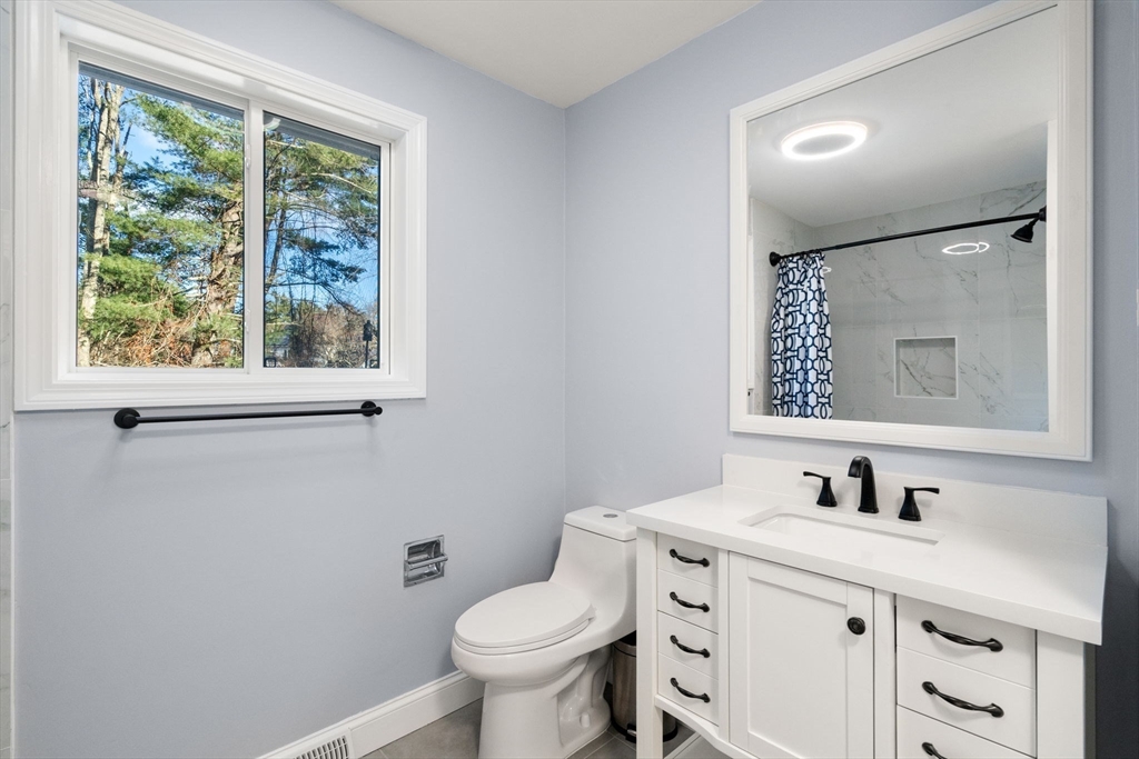 9 Mallard Drive Sharon, MA 02067 - Photo 25 of 32 a bathroom with a toilet sink and mirror