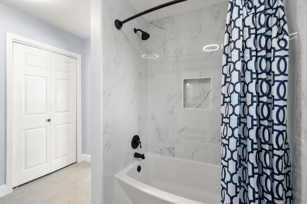 9 Mallard Drive Sharon, MA 02067 - Photo 26 of 32 a bathroom with a bathtub and shower