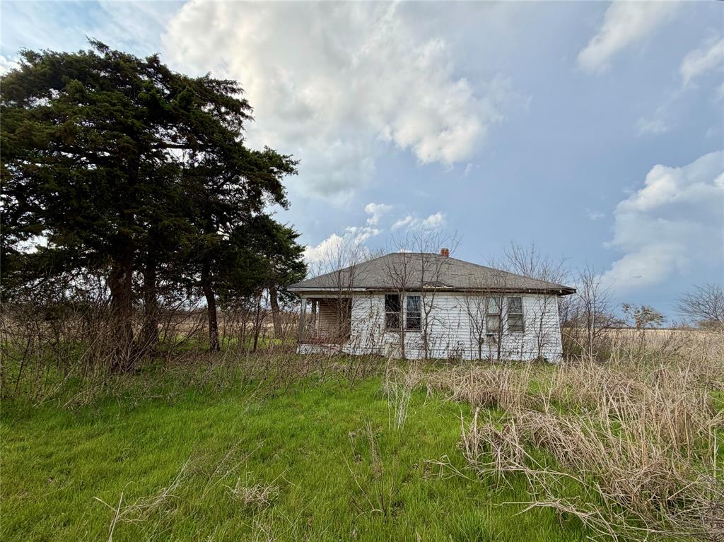 1900 Nesuda Road Ennis, TX 75119 - Photo 9 of 17 a small garden covered with tall trees