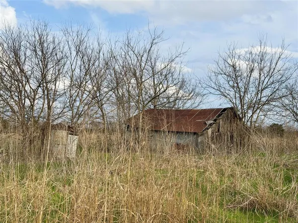 a view of a lake with a dry yard