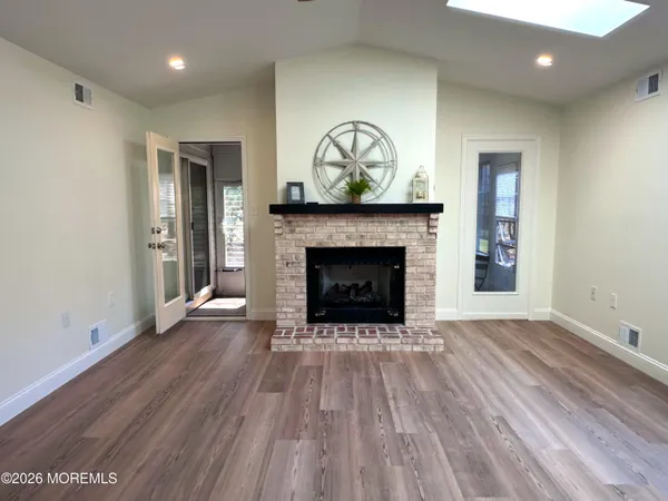 a view of a patio with couches and a potted plant on a table